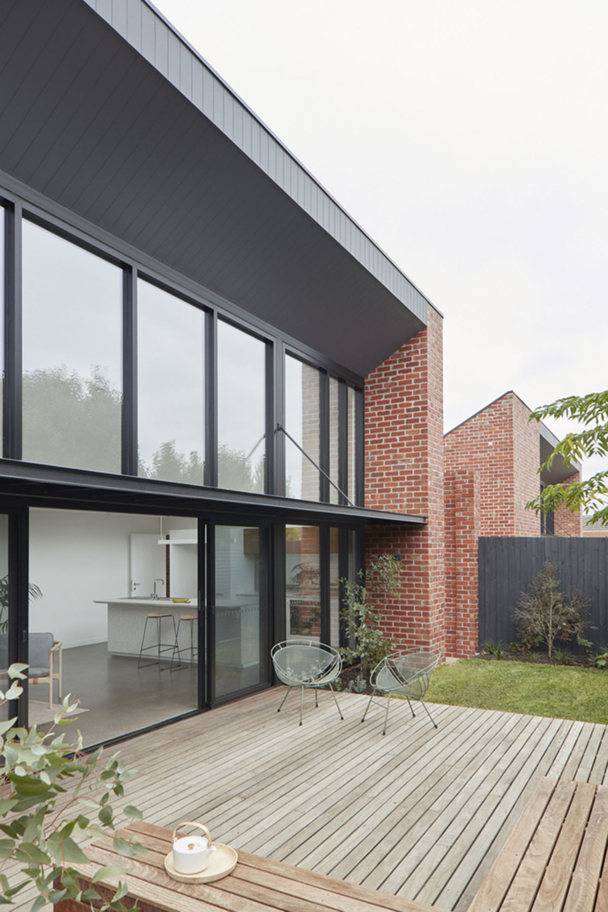 Recycled Brick Screens Wrapping These Two Dwellings Help Thermal 