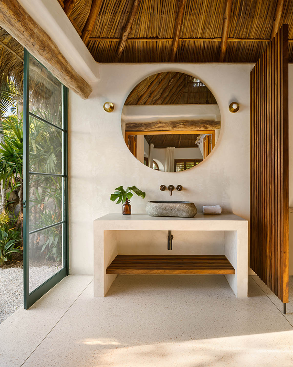 MAIN OFFICE adds half-circle yoga platform to thatched-roof guest villas in Sayulita, Mexico