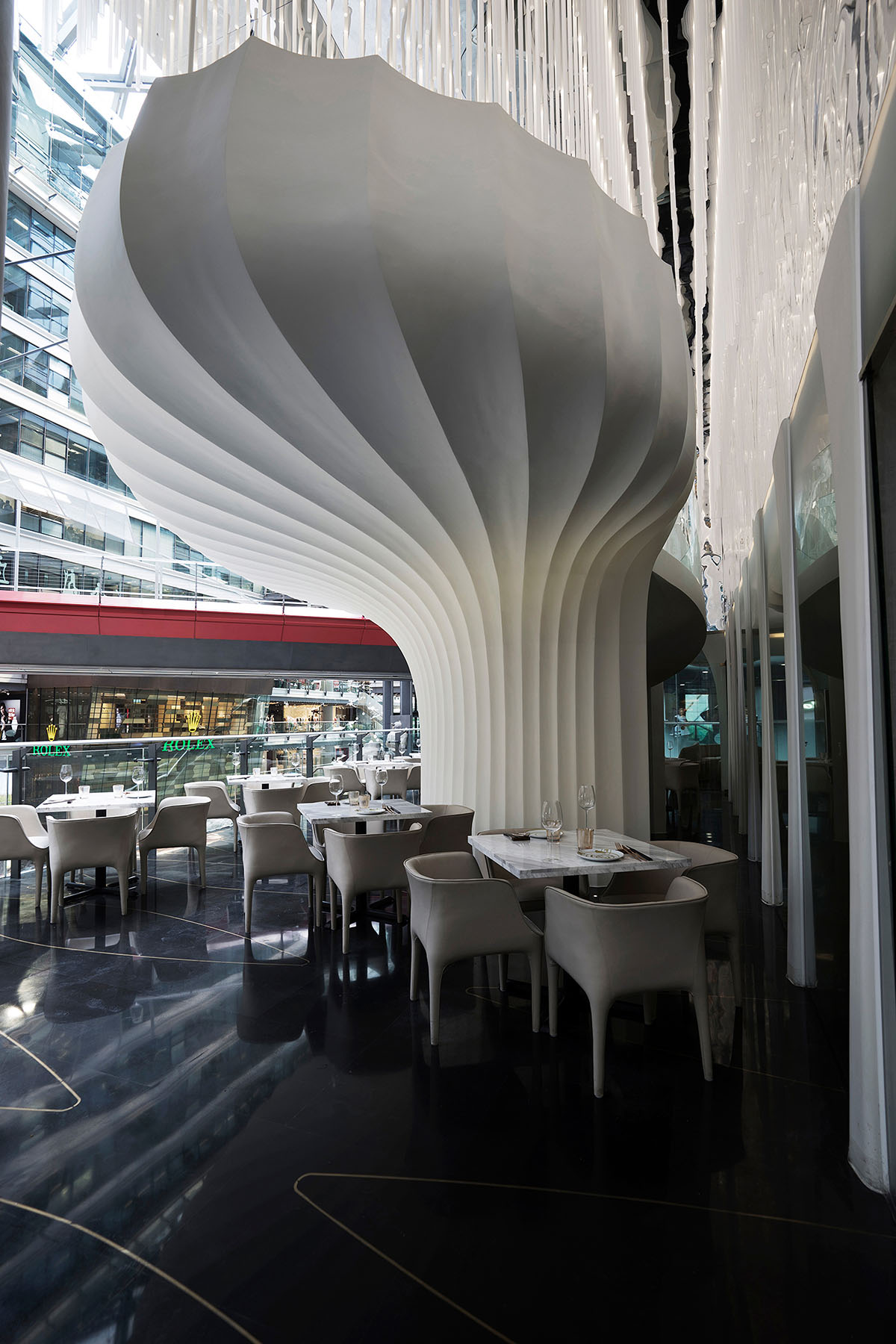 CAA Architects creates flower-like double-deck terrace in the interior of restaurant in Beijing