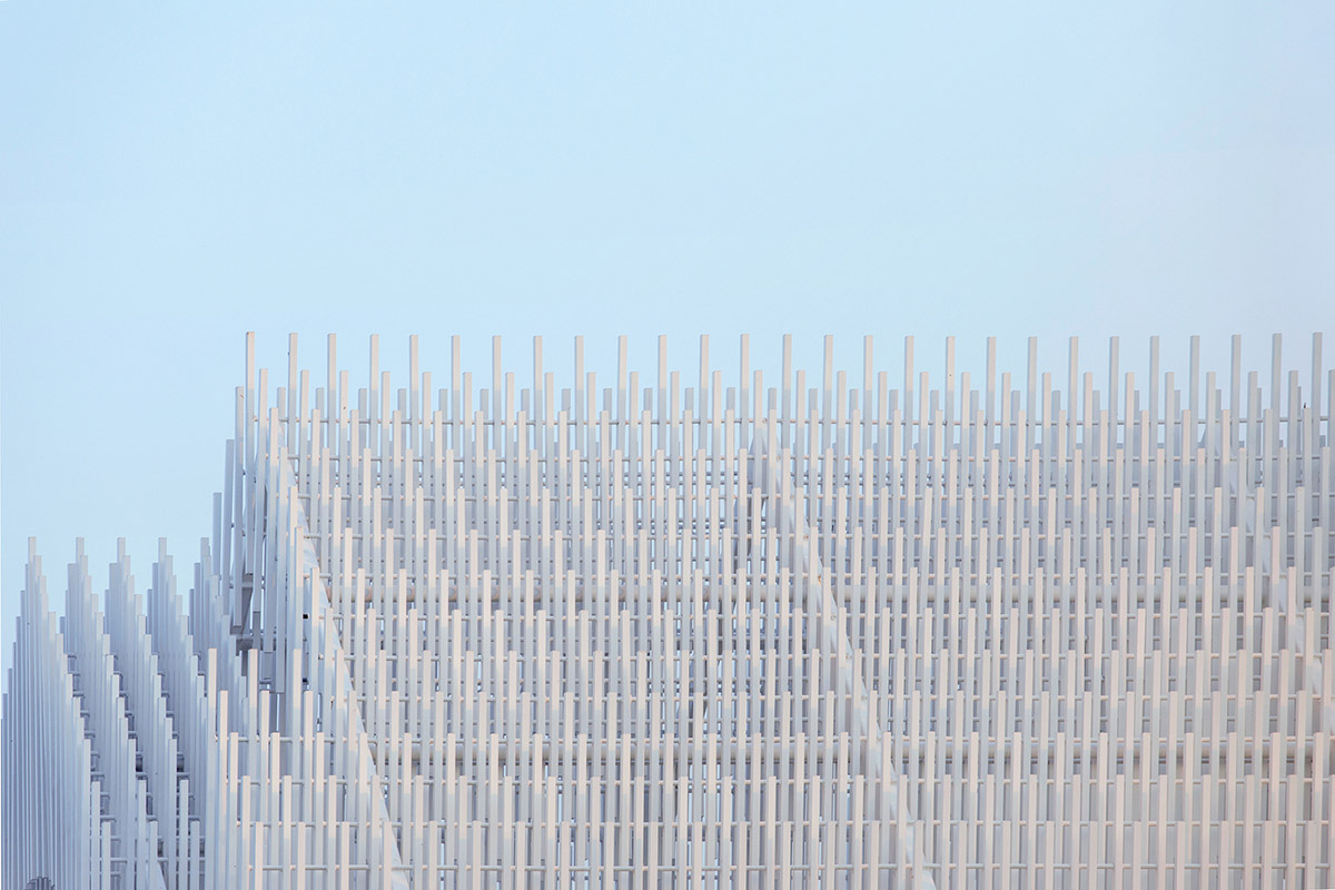 A church made of thousands of white thin beams looks like suspended in the air in lavender field