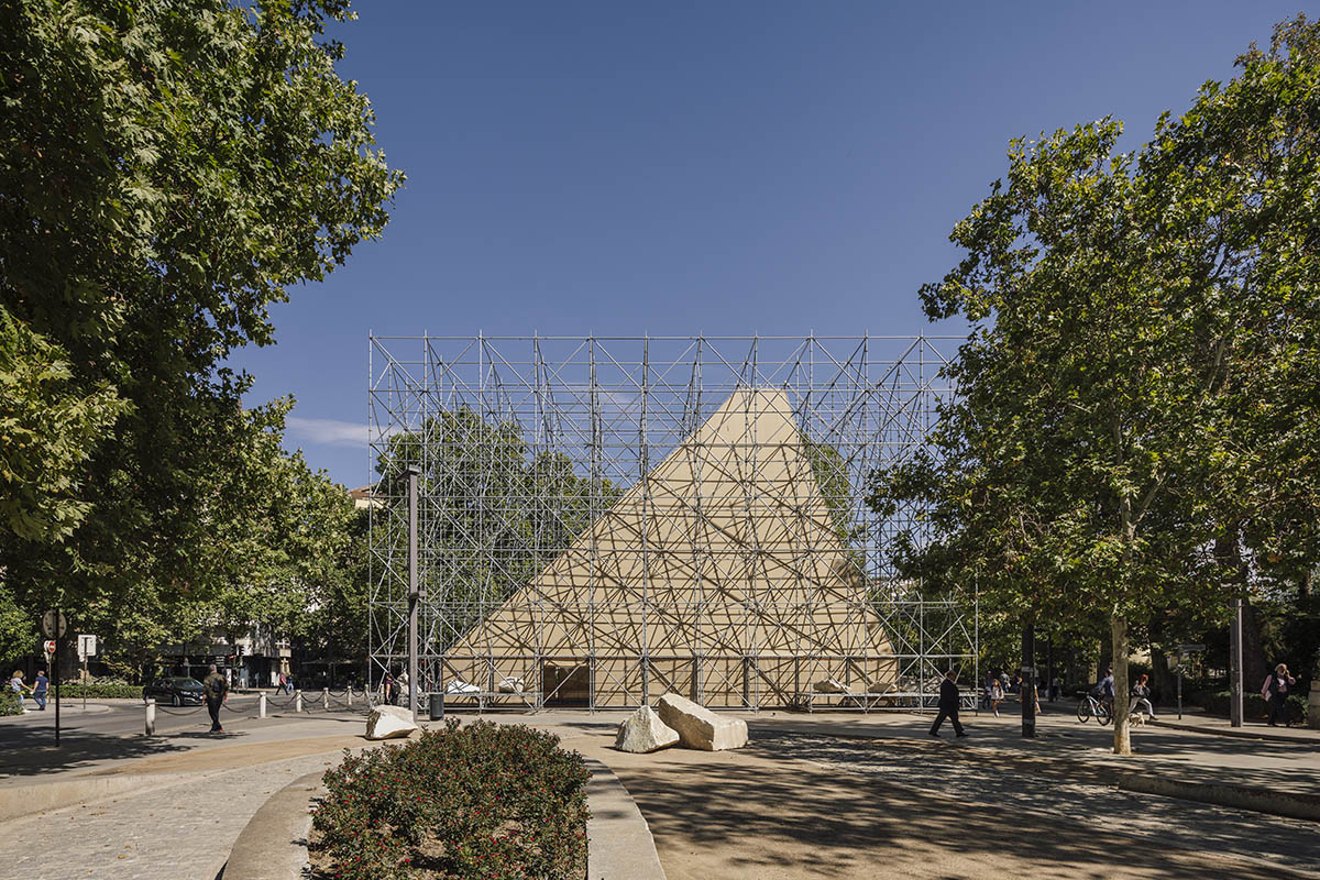 Aire Pavilion wrapped by giant scaffolding represents 