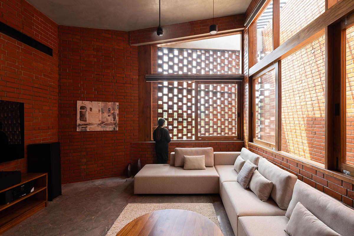 Srijit Srinivas - ARCHITECTS built brick family house with angled triangular façade in Kerala