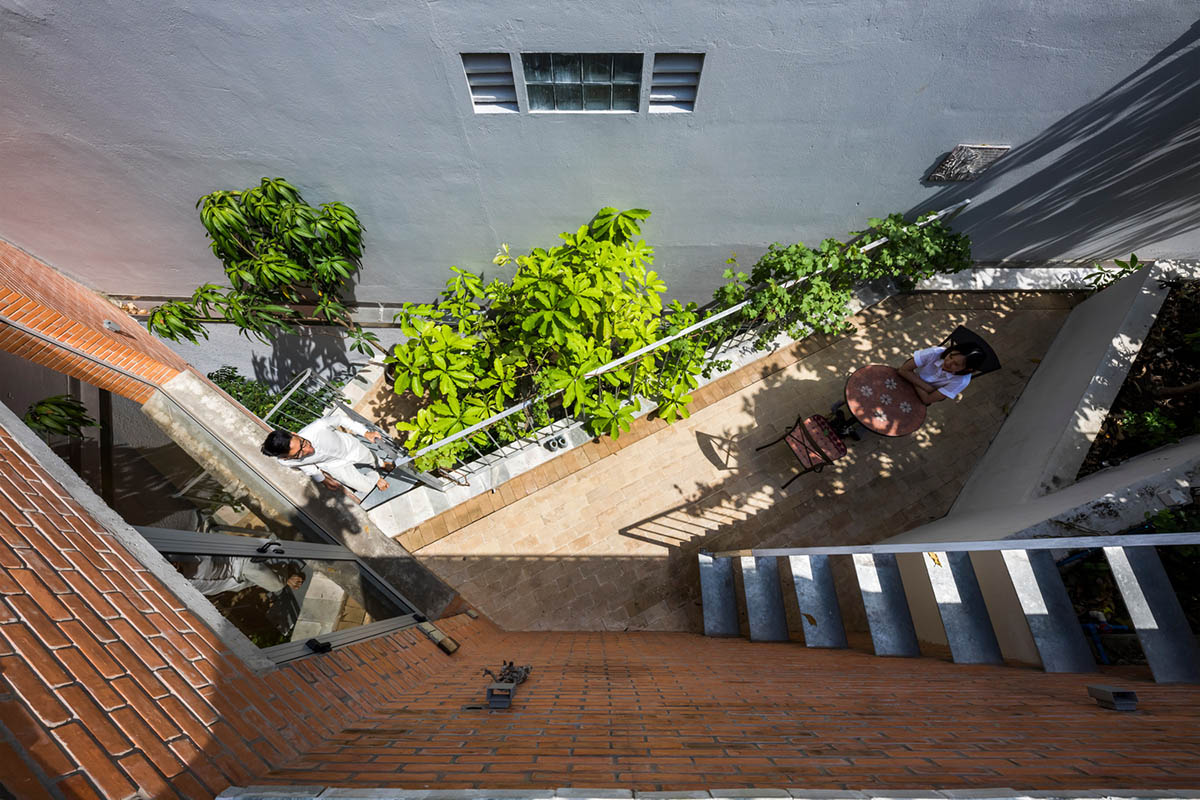 VTN Architects' new cascading family house creates large green gardens in a narrow site of Vietnam