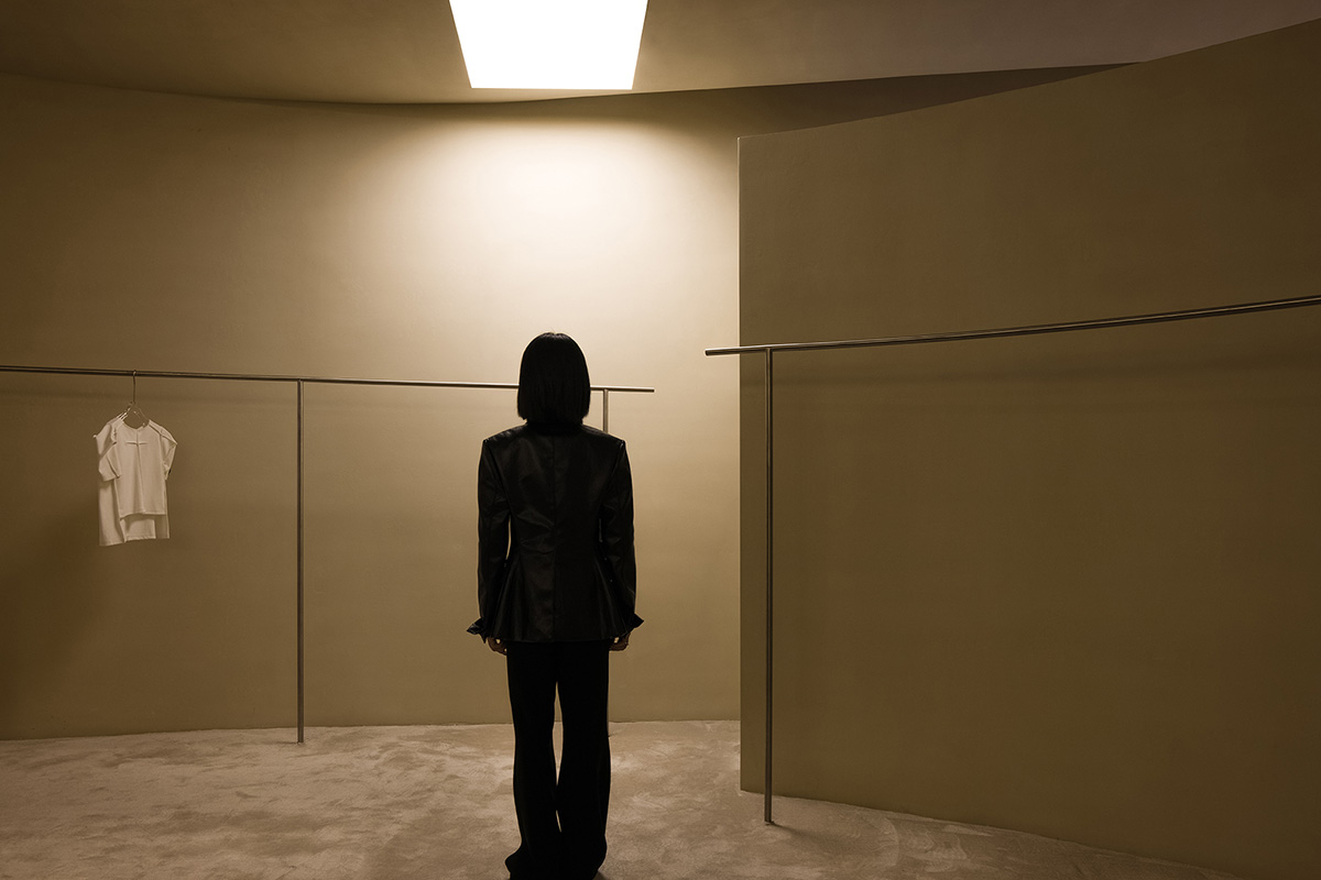 AD ARCHITECTURE designs store with light yellow curved walls that create comfort and softness 