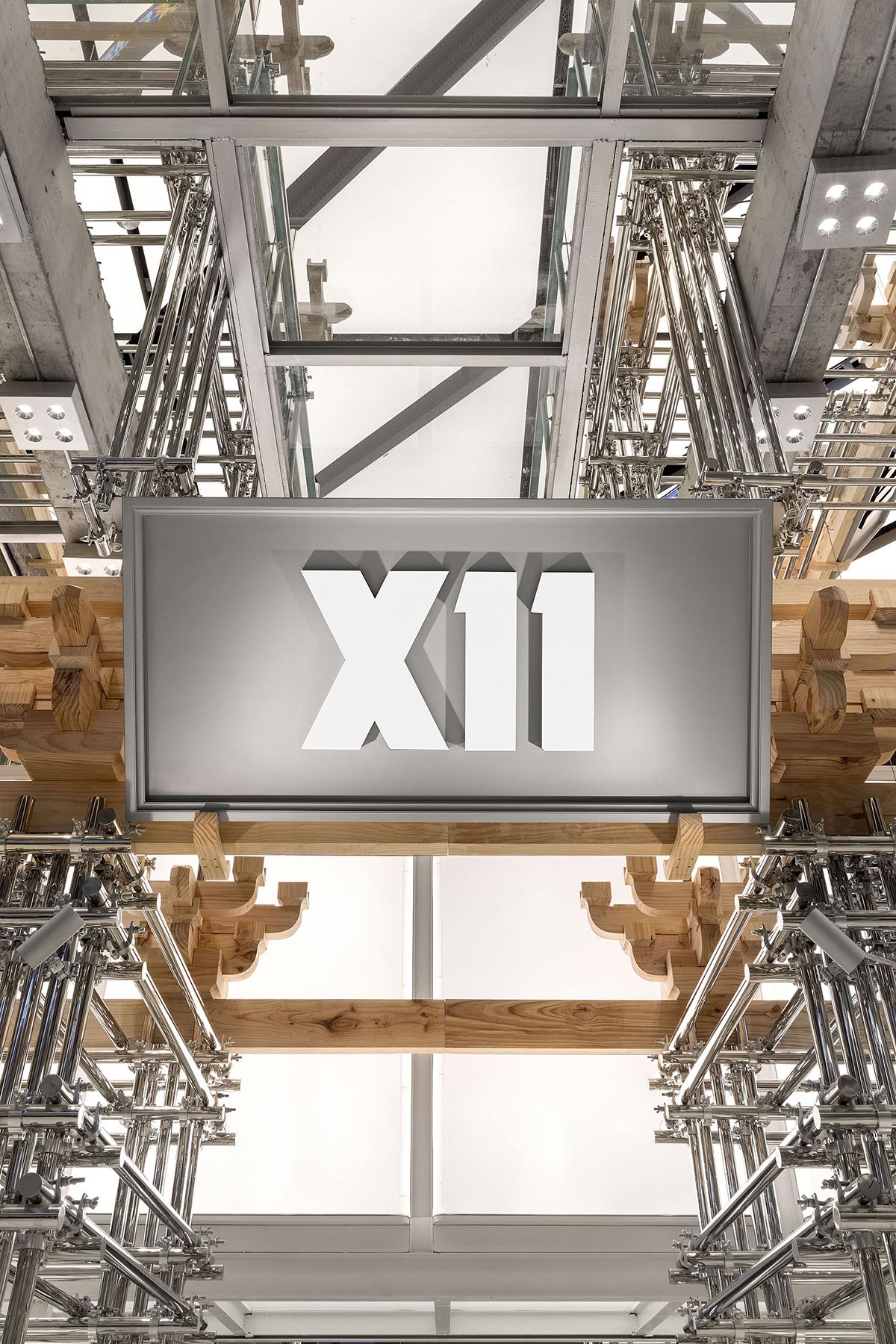 BloomDesign combines stainless steel tubes with timber joints to create retail store in China 