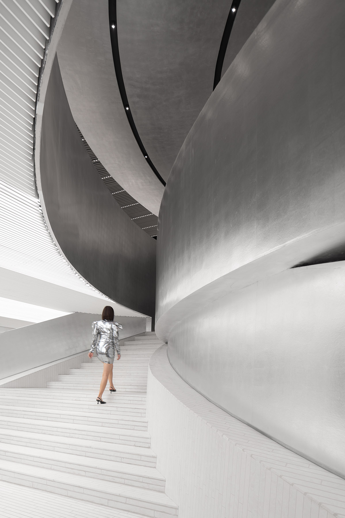 Various Associates designs beauty store with winding staircase and silver-toned interiors in Hangzhou