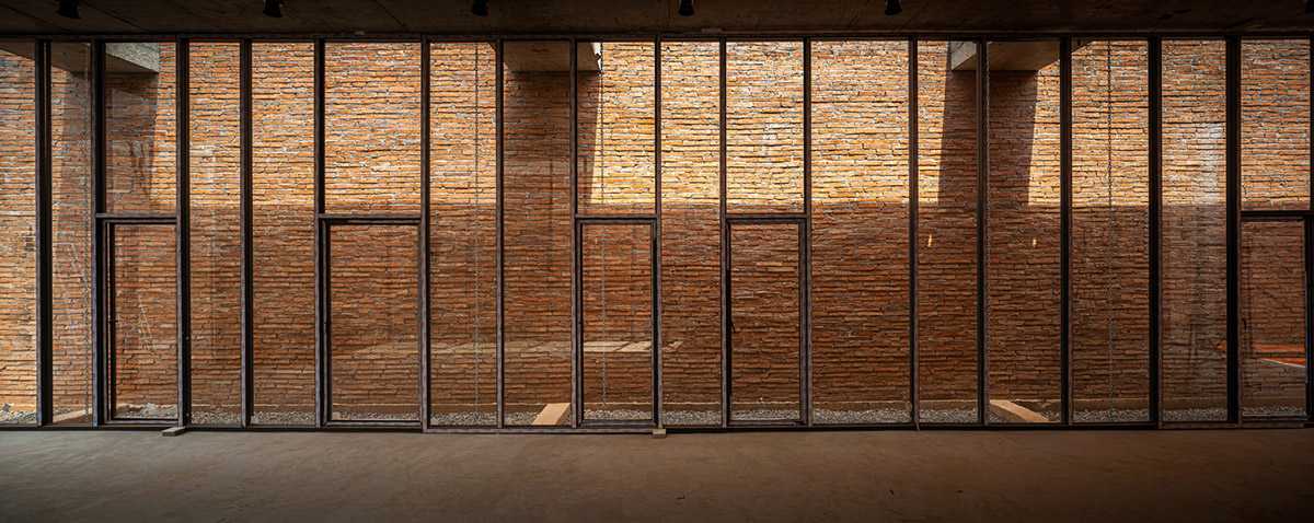 Bangkok Project Studio used over 480,0000 fired clay bricks to form elephant museum with curved walls