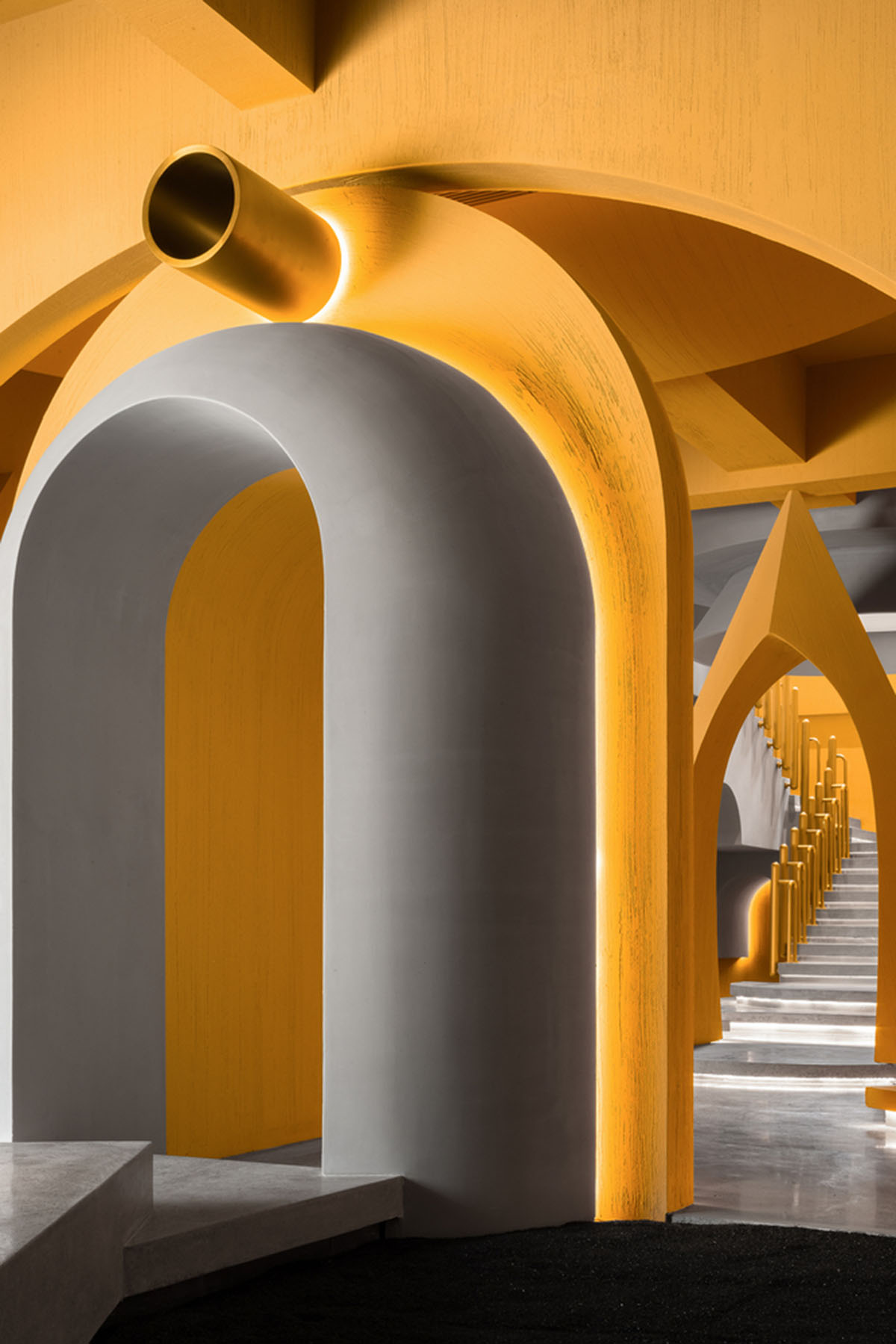 Angular corrugated stainless steel sheets form this showroom designed by PIG DESIGN in Hangzhou