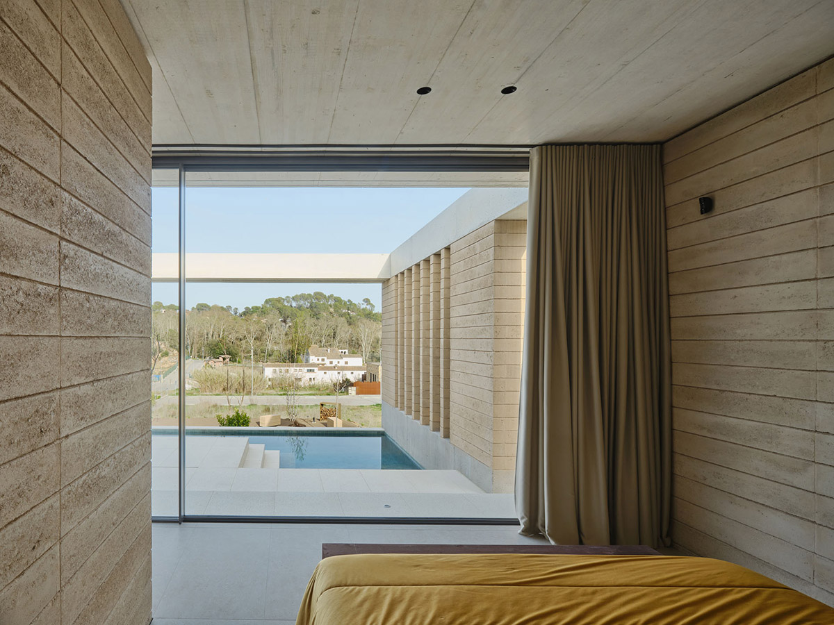 Atheleia Arquitectura completes Casa Artiga with rammed earth walls in Barcelona 