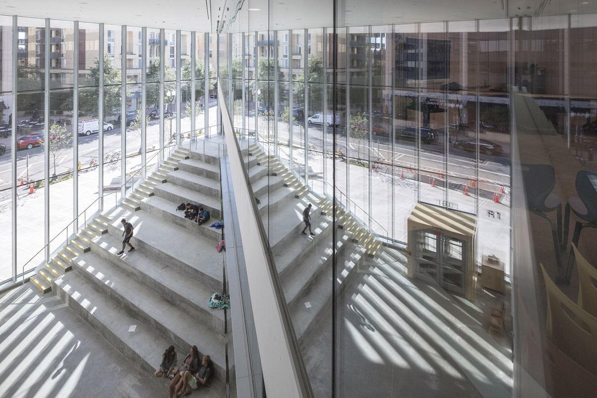 Five rectangular volumes rotating around a fixed pivot point form BIG-designed educational building