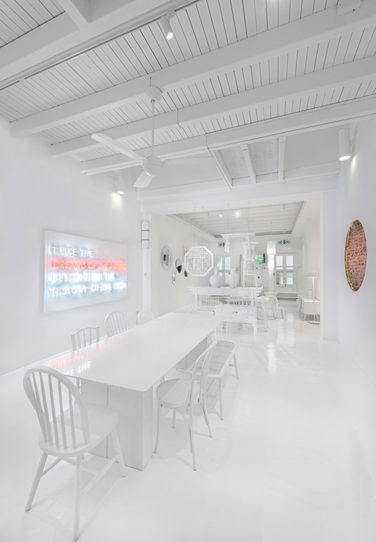 Ministry of Design transforms old dwelling in Singapore into co-living house with all-white interiors