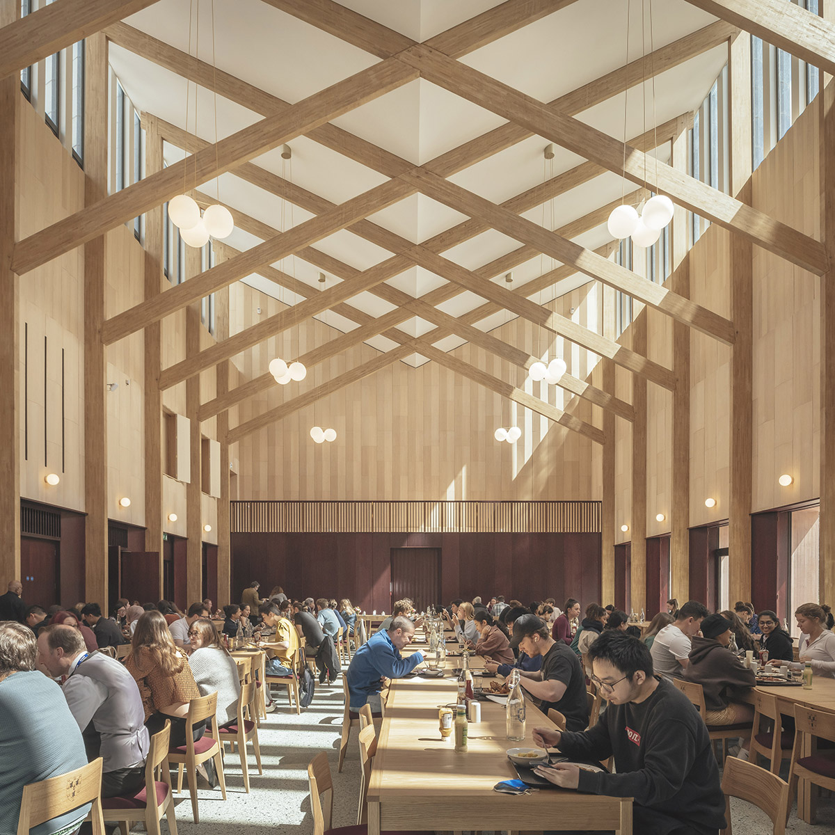 Feilden Fowles completes dining hall wrapped in green faience tiles at University of Cambridge