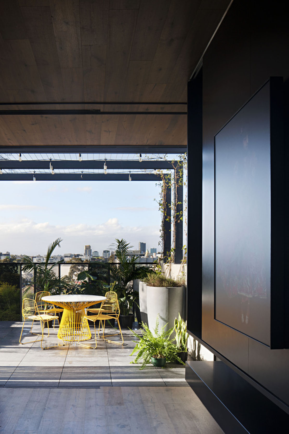 Protruding glass boxes form mixed-use housing in a narrow plot in Melbourne