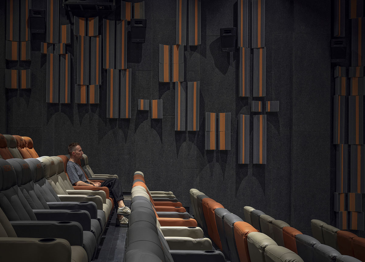 Greyscale interior provides acoustically comfortable space for a cinema by One Plus Partnership