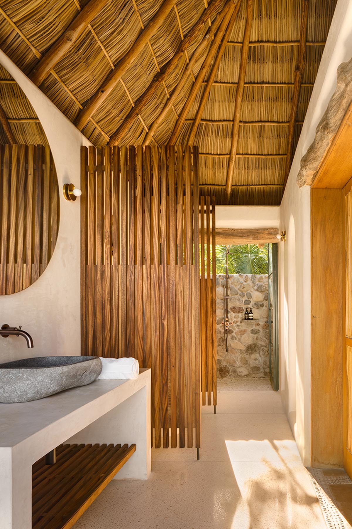 MAIN OFFICE adds half-circle yoga platform to thatched-roof guest villas in Sayulita, Mexico