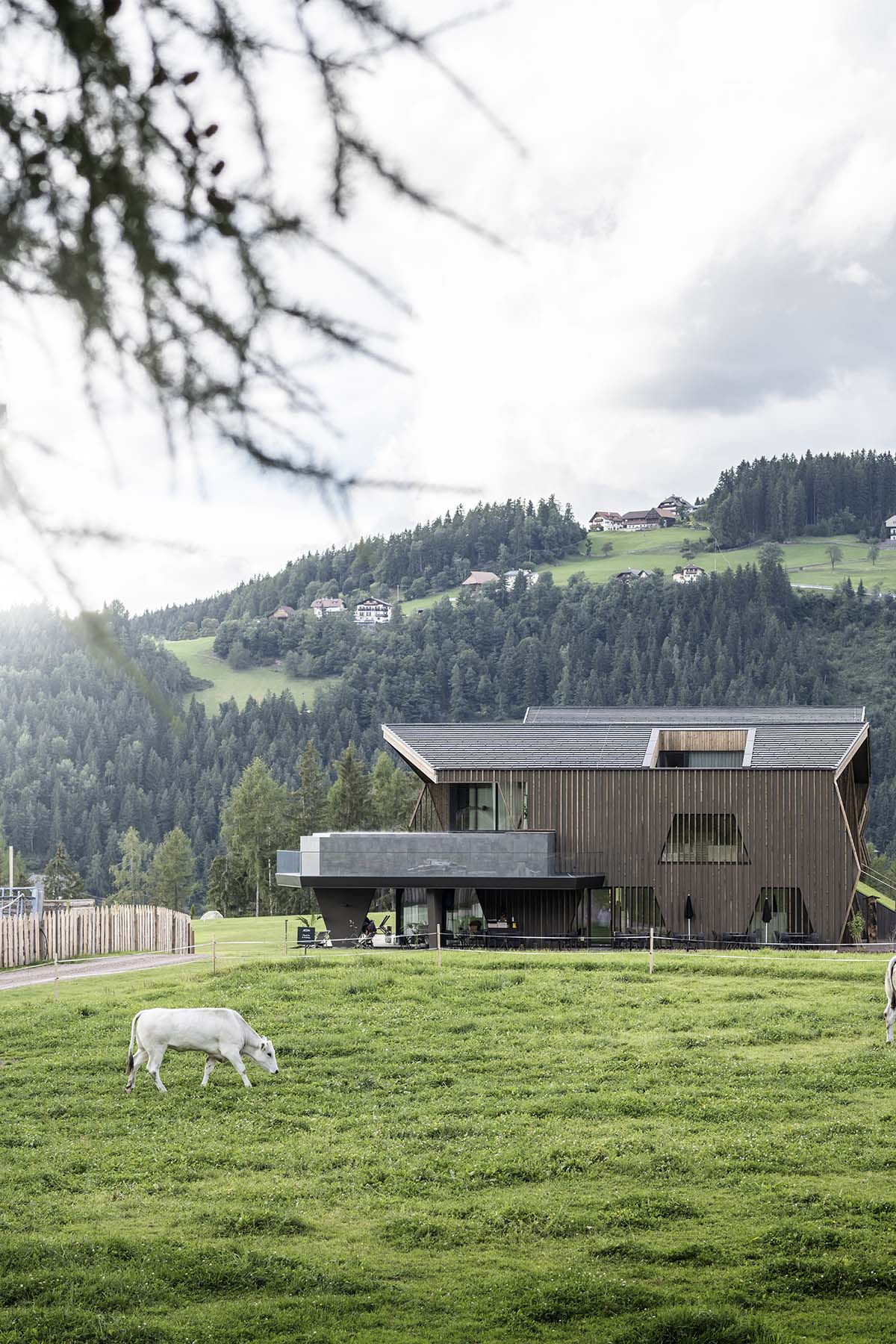 noa* designs boutique hotel and wellness featuring trapezoidal façade in an old farm of Soprabolzano