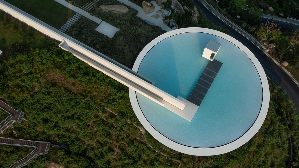 3andwich Design / He Wei Studio built circular library featuring a rooftop pool in China