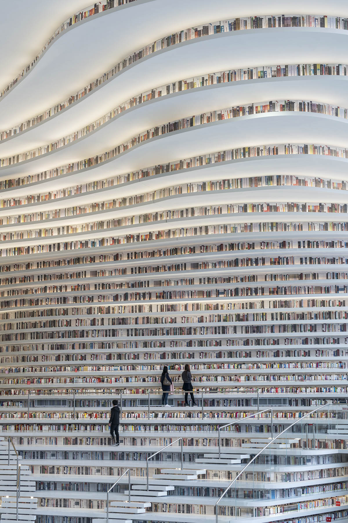 MVRDV’s topographical Tianjin Binhai Public Library featuring millions of books opens in China