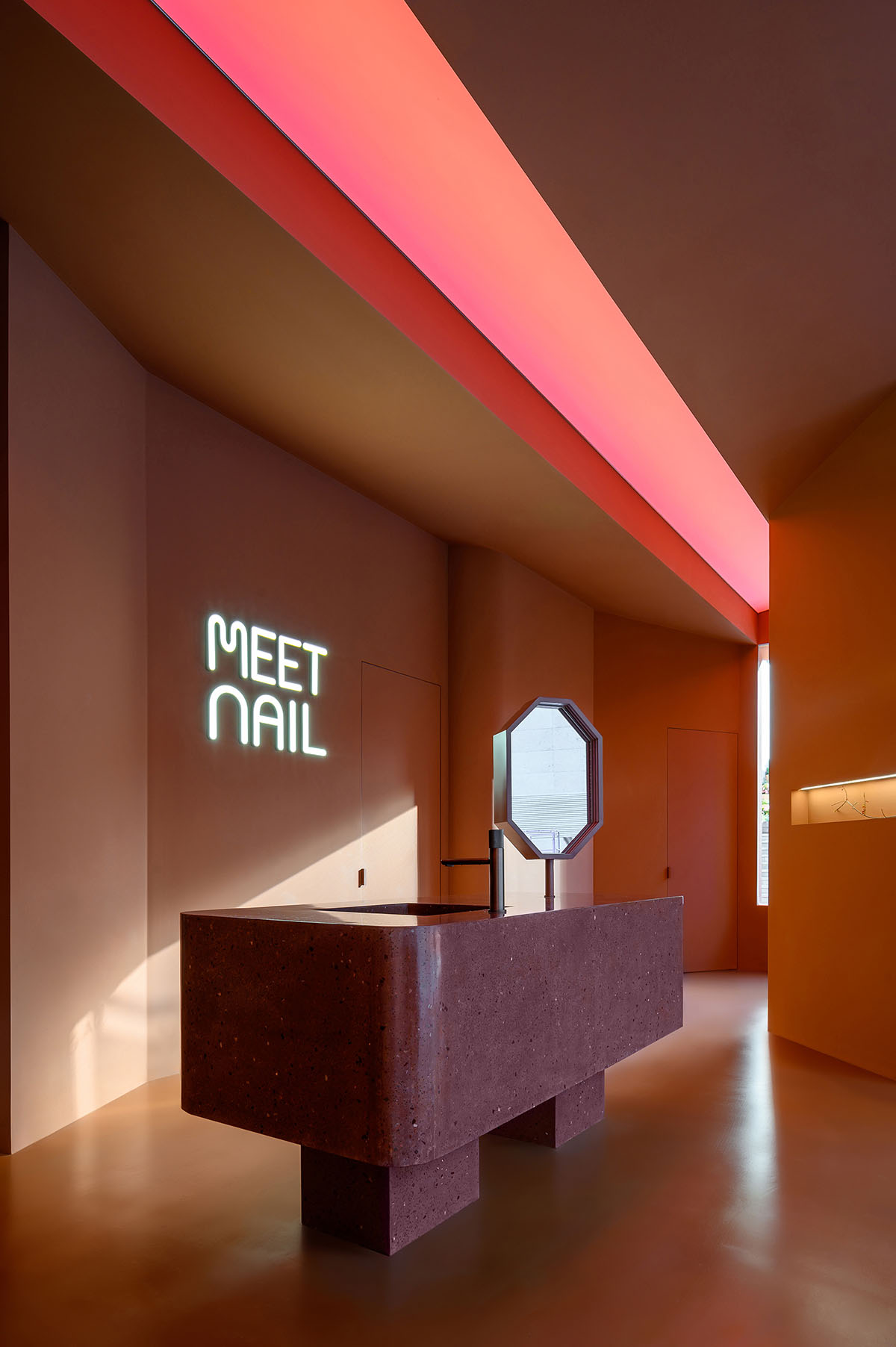 Bold peachy colors define interiors of nail flag store designed by 8877 Interiors in Shanghai 