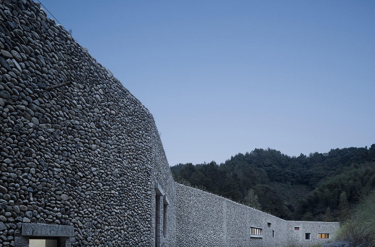 UAD built culture and history museum with terraced stone walls mimicking the site's landform 
