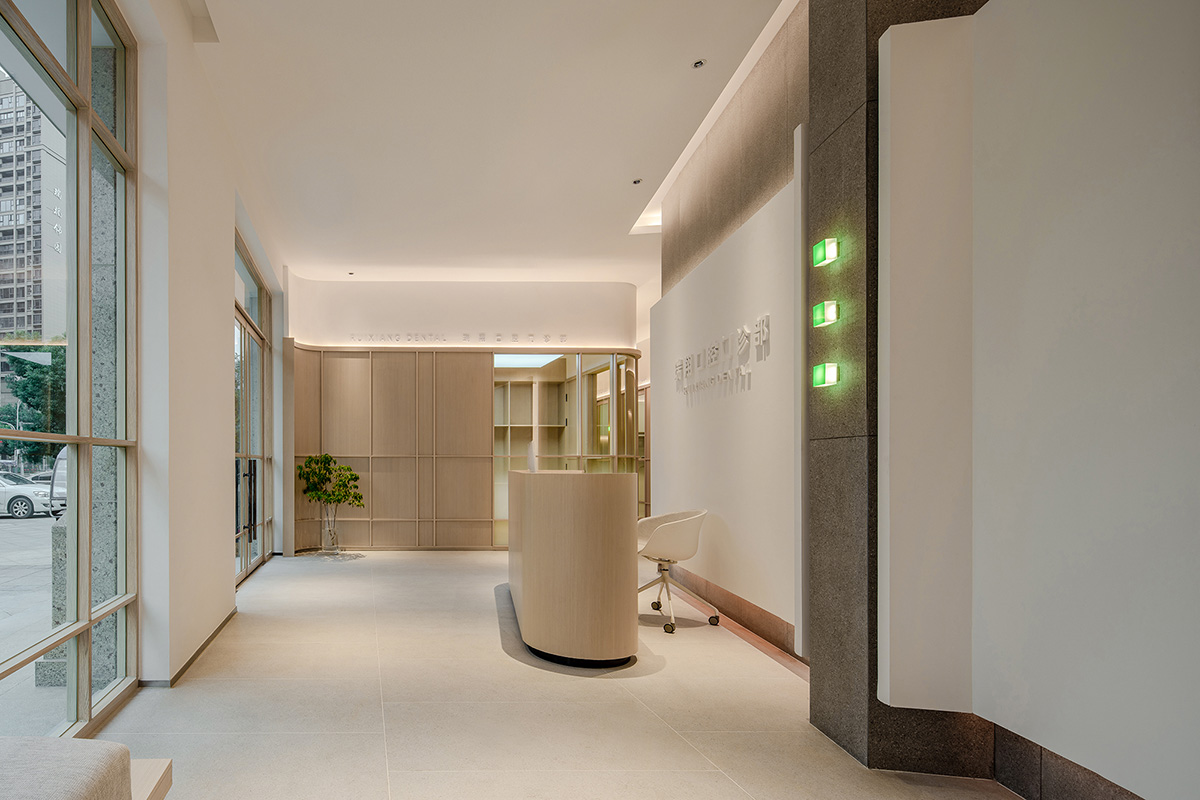 JACKY.W DESIGN completes dental clinic with rounded wooden walls and natural tones in China 