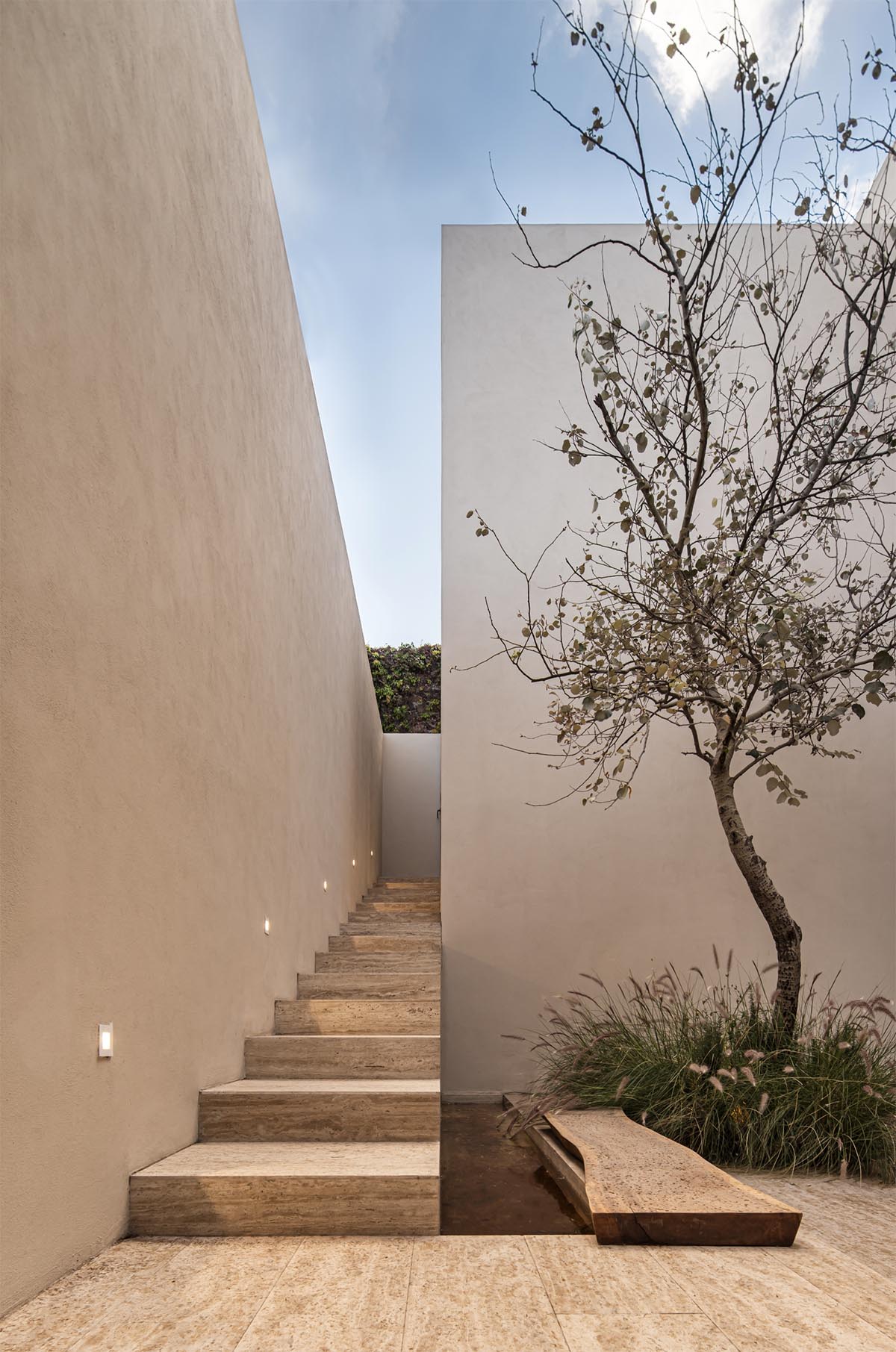 Sabino 10 residence by Editorial features a solid façade with hermetic volumes in Mexico