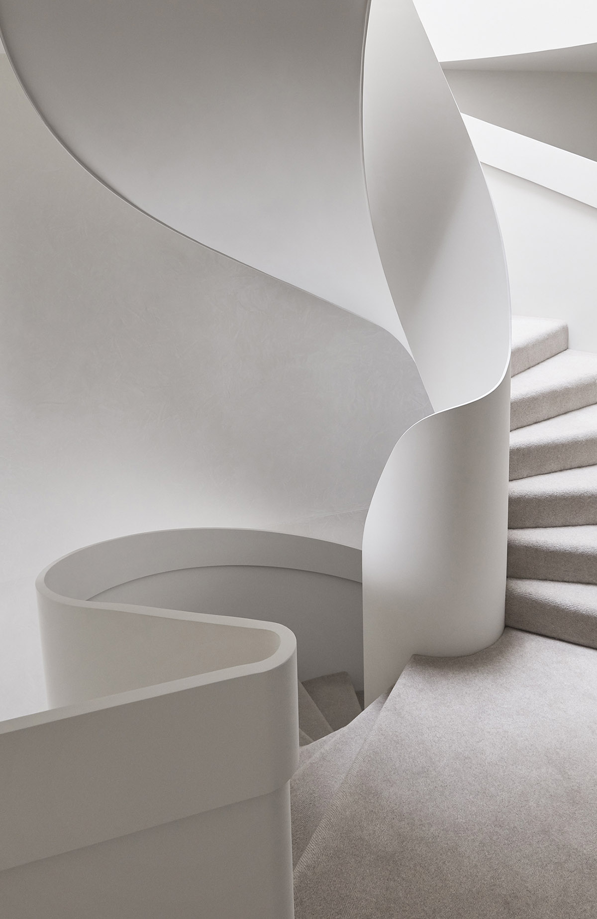 Jolson Architecture and Interiors creates fluid surfaces for interiors of this Melbourne home