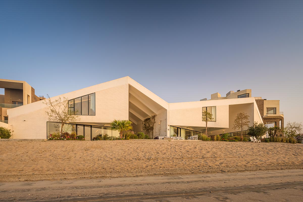 Family House Is Covered By Folded Roof To Create A TentLike Structure