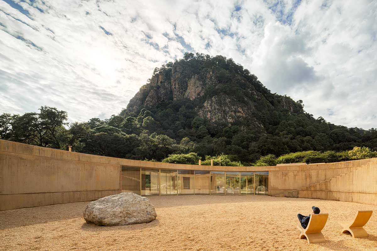 Fernanda Canales creates a circular home framing a mountain and a volcano in Mexico
