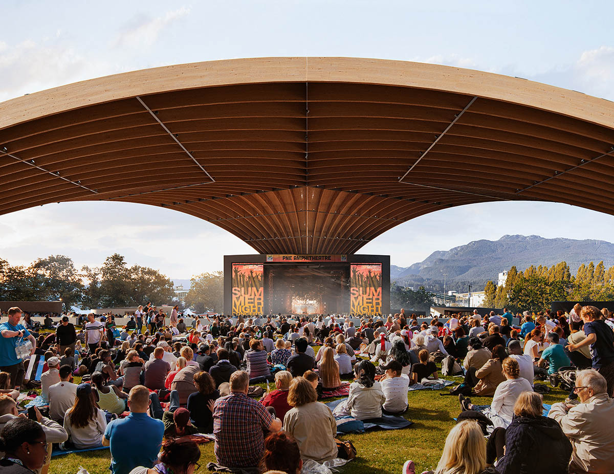 Revery Architecture covers the PNE Amphitheatre with a massive starburst timber roof in Vancouver