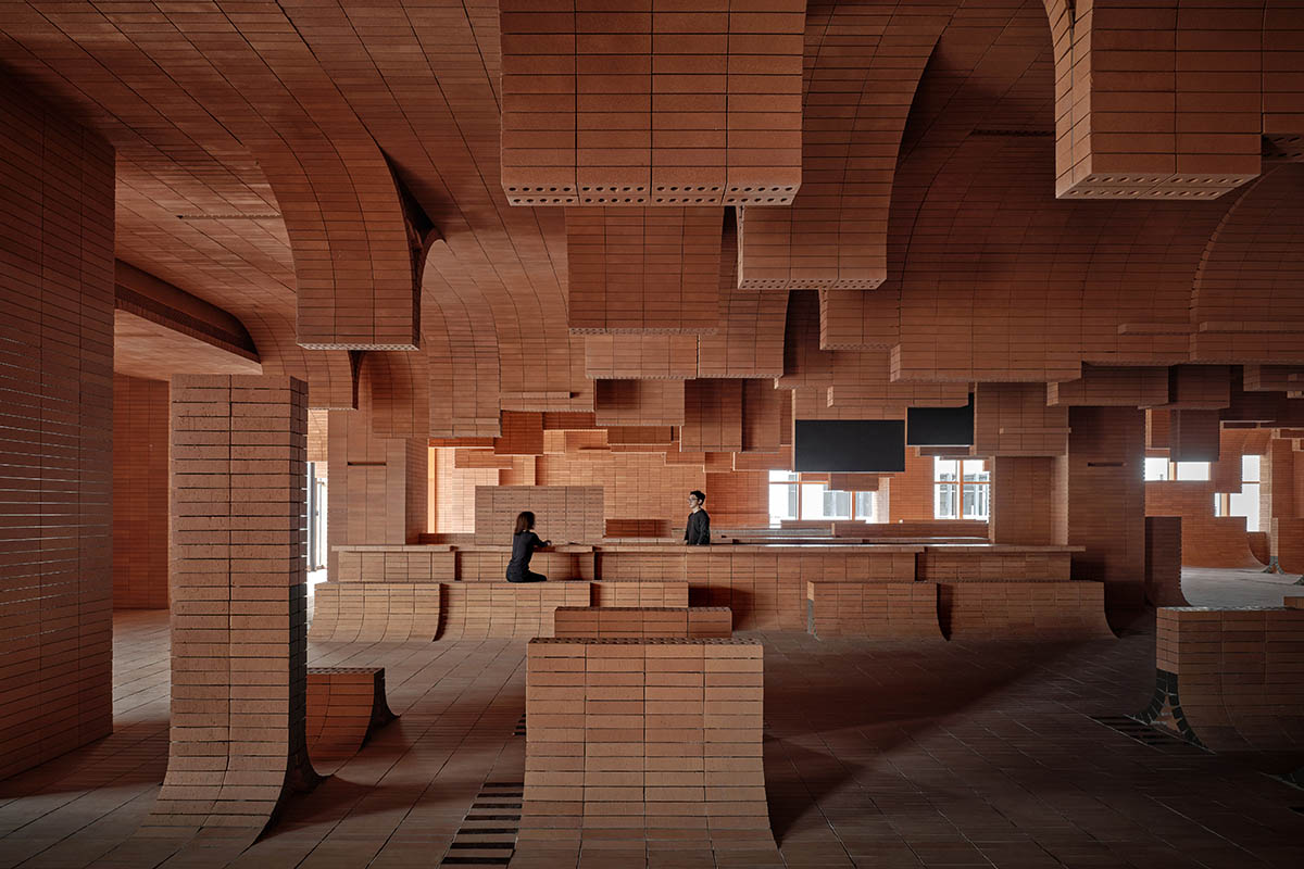 One Plus Partnership adds layered bricks to a cinema interior to resemble waves in Haikou