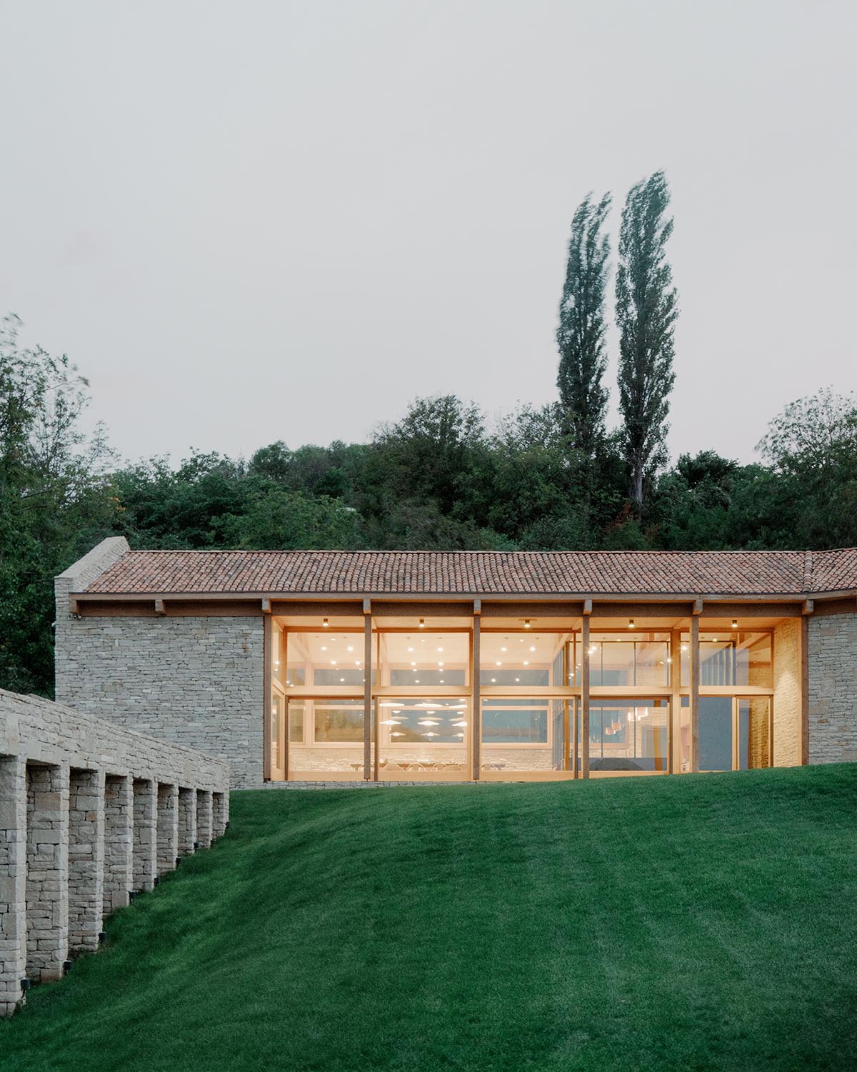 The stone and wood Tbilisi residence integrates architecture with the natural landscape