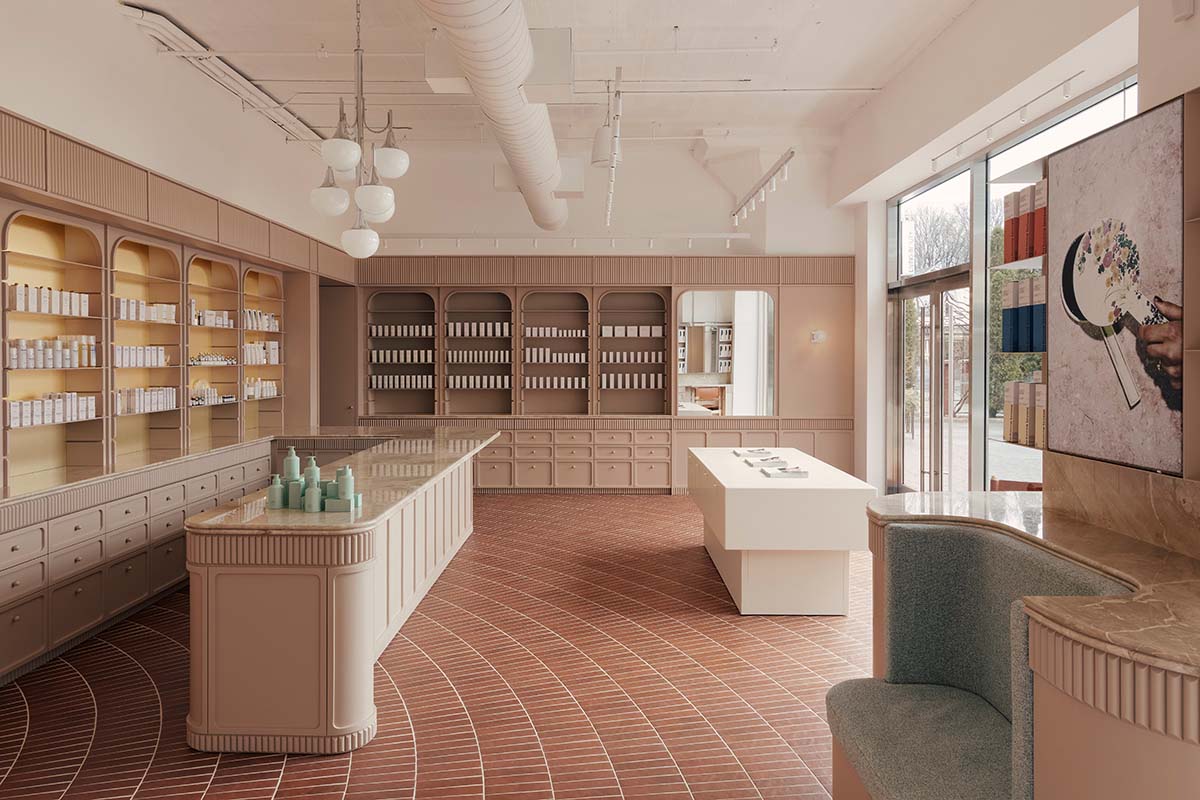 Odami enriches the interiors of a beauty shop with rounded, bevelled details, and pinkish hues