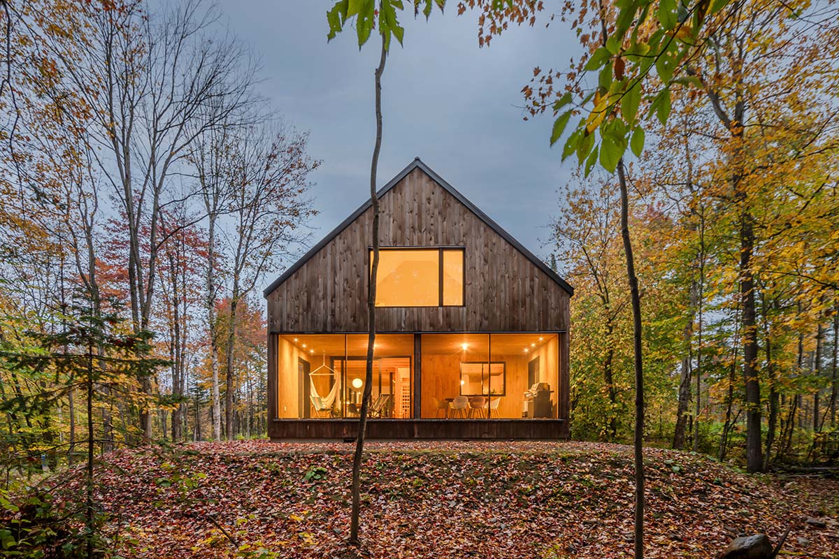 Country home is a wooden shelter that brings tranquility in the heart of the forest in Canada