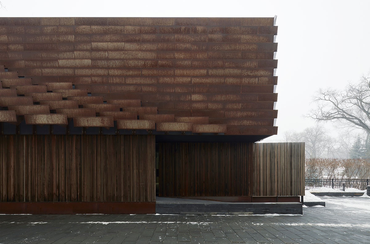 Weathered steel weil wraps the façade of Veil House in to resist snowfalls in Winnipeg