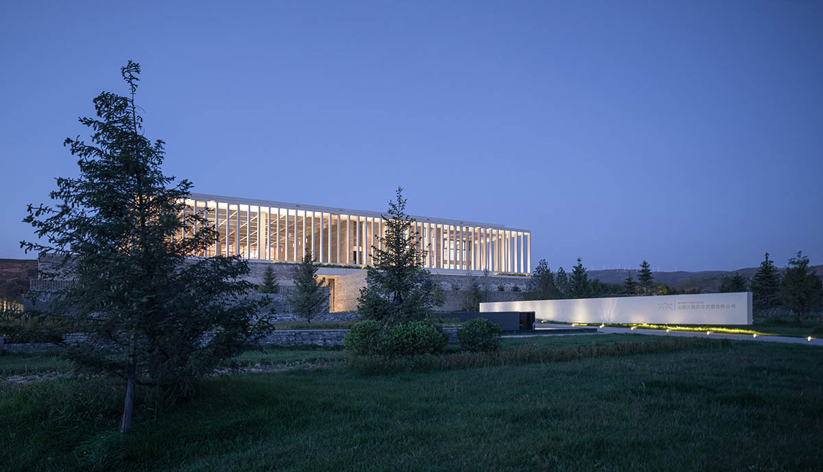 Grey brick walls wrap a factory building referencing to local construction methods in China 