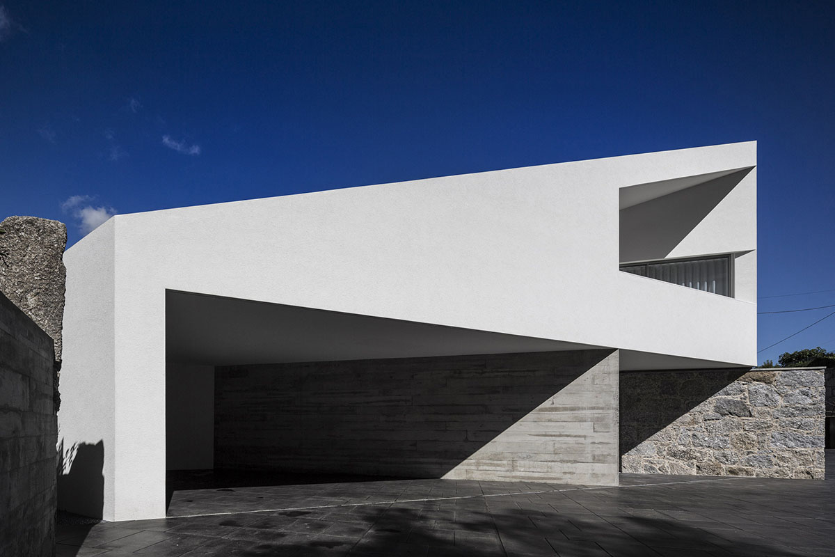 Rui Vieira Oliveira Built Multifaceted House placed atop Ancient Grape Mill In Portugal's village