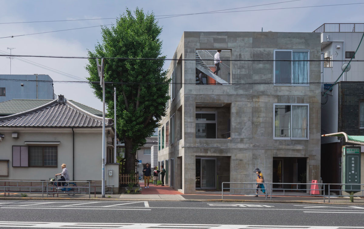 Tato Architects creates painted effect to this concrete hotel by using colourful curtains in Osaka