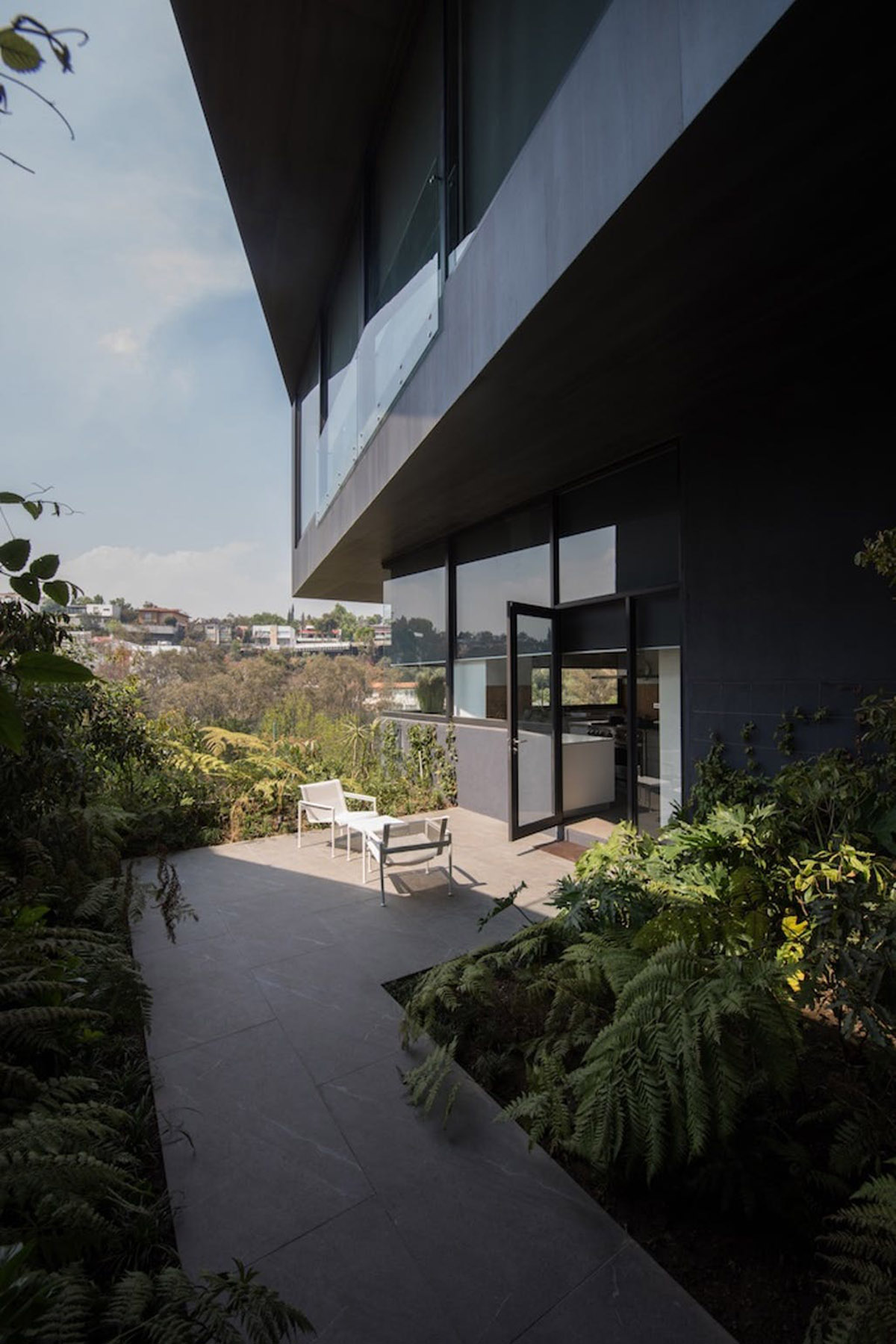 Sordo Madaleno Arquitectos' folded house perfectly sits on rugged topography of Mexico City