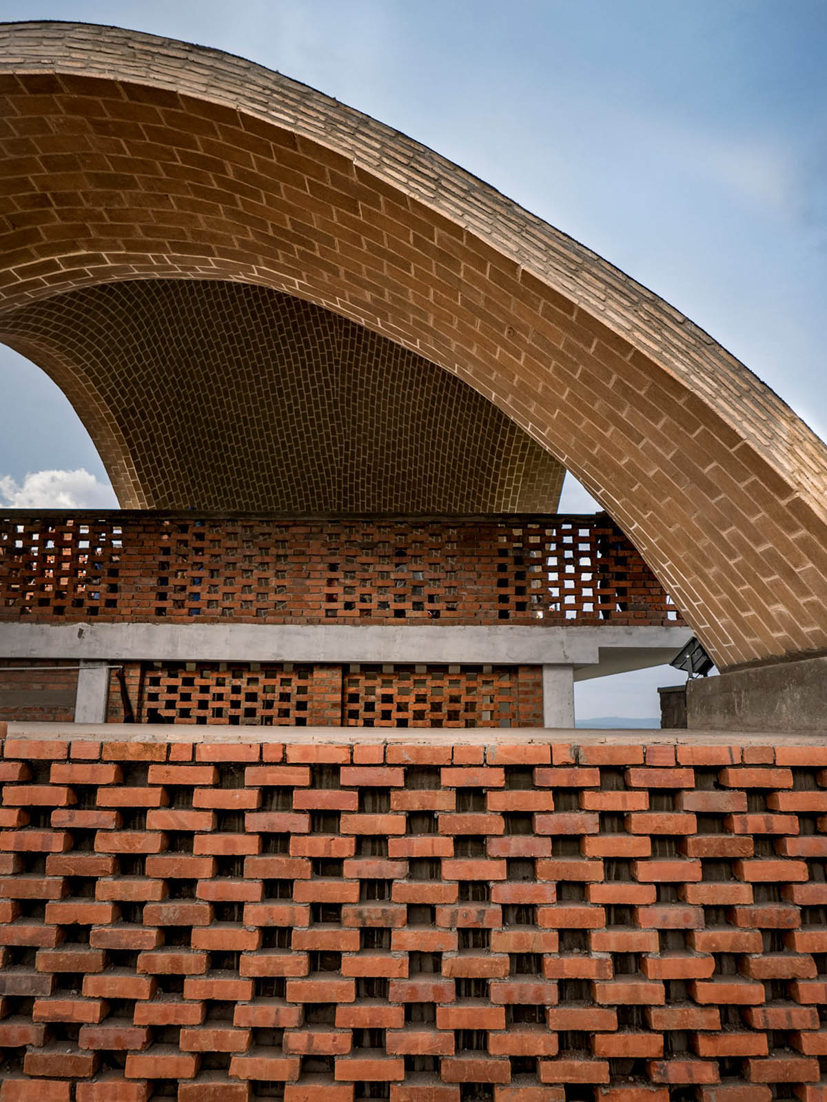 Light Earth Designs' parabolic Cricket Stadium addresses to cherished hilly topography of Rwanda