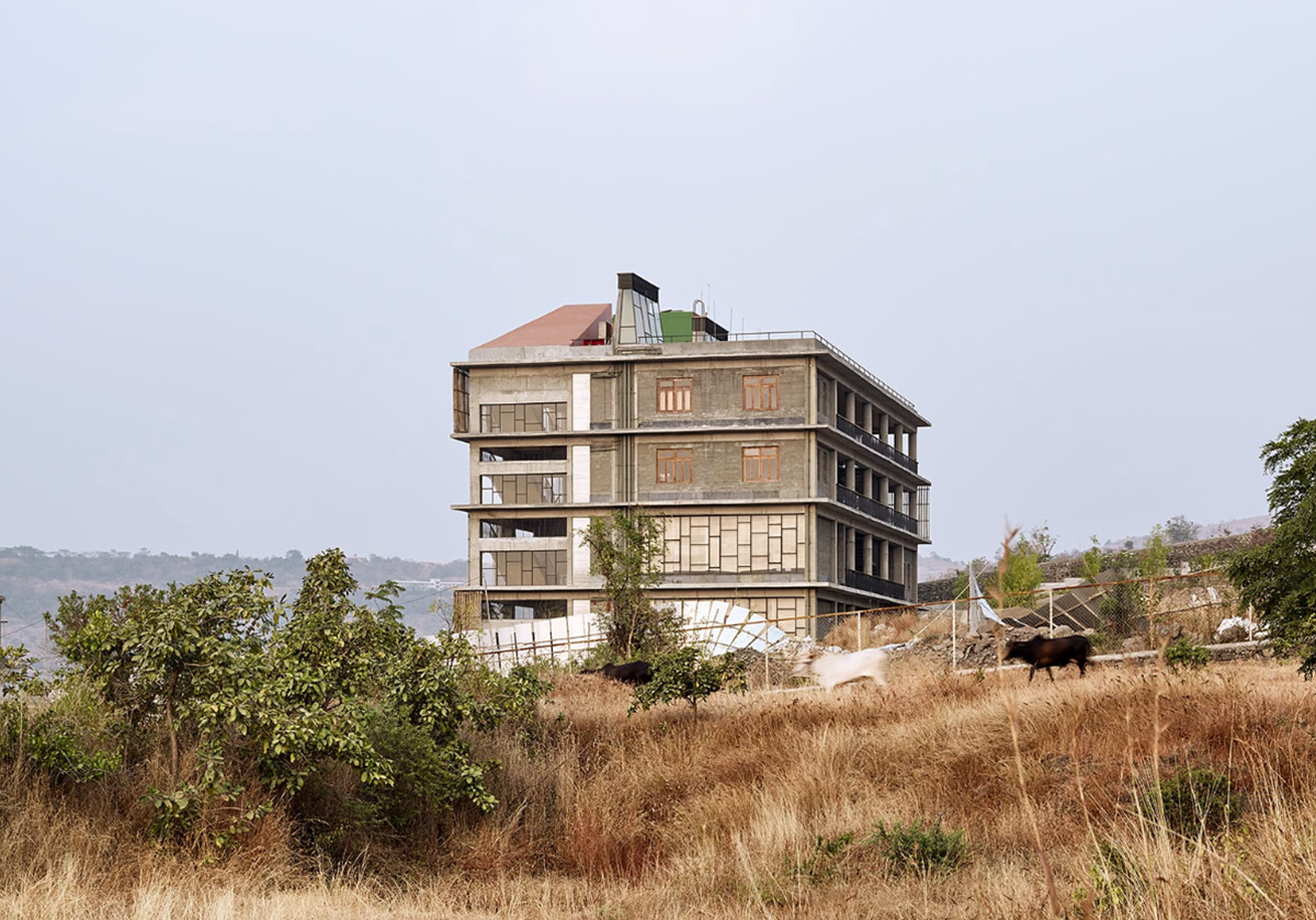 Avasara Academy, resembling an unfinished structure, educates young women in the moorland of Pune