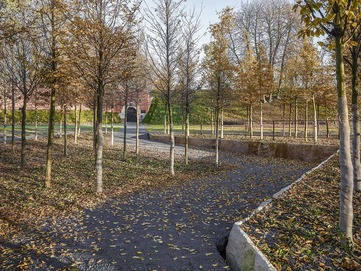 BBGK Architekci designed 12-metre-high stained concrete wall to narrate victims for Katyn Museum