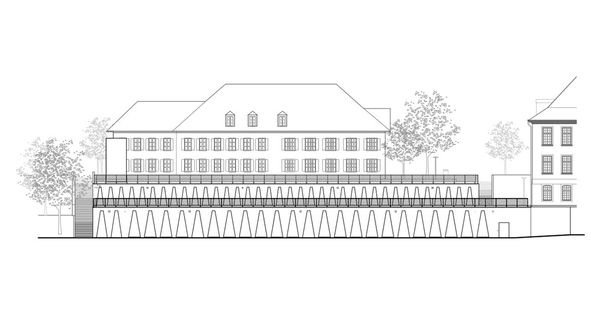 Trapezoidal openings characterize the interiors of cultural center by Estudio Barozzi Veiga in Zürich