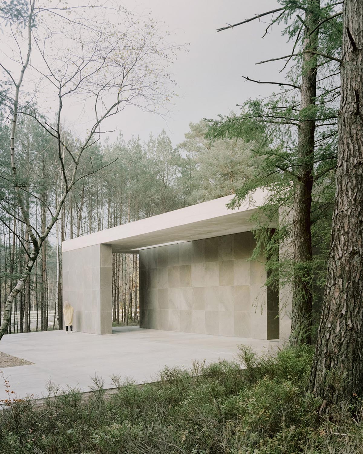 KAAN Architecten built serene Loenen Pavilion commemorating Dutch victims among pine trees