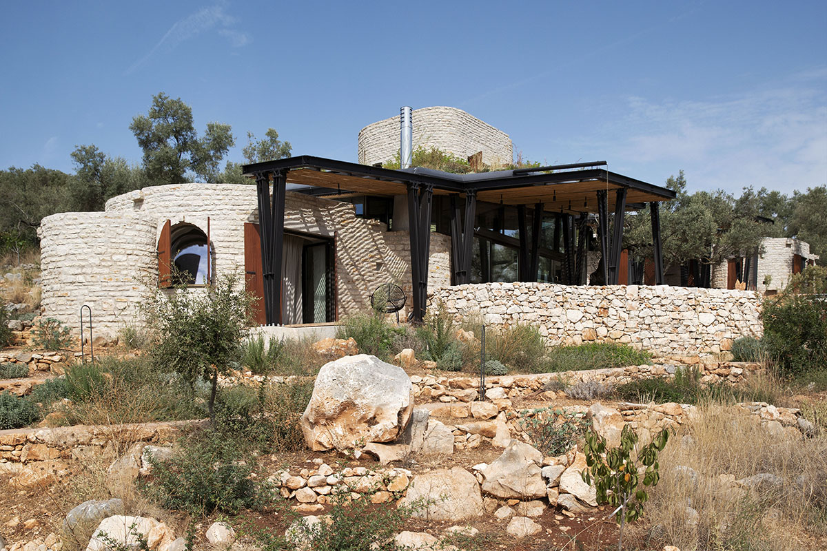 Pastoral round stone dwellings inform Meganisi House by Hiboux Architecture on Meganisi island