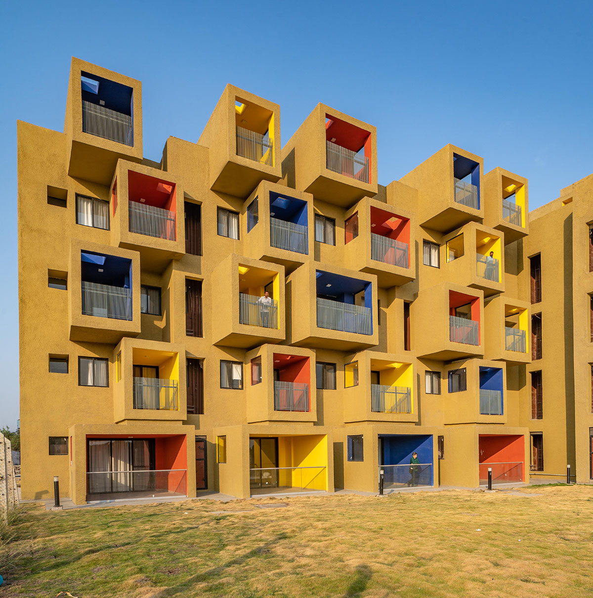 Sanjay Puri Architects designs residential building with colorful cuboid terraces in India
