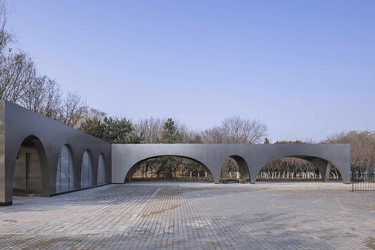 TEMP designs runner's station with stainless steel arcades in Beijing Olympic Forest Park