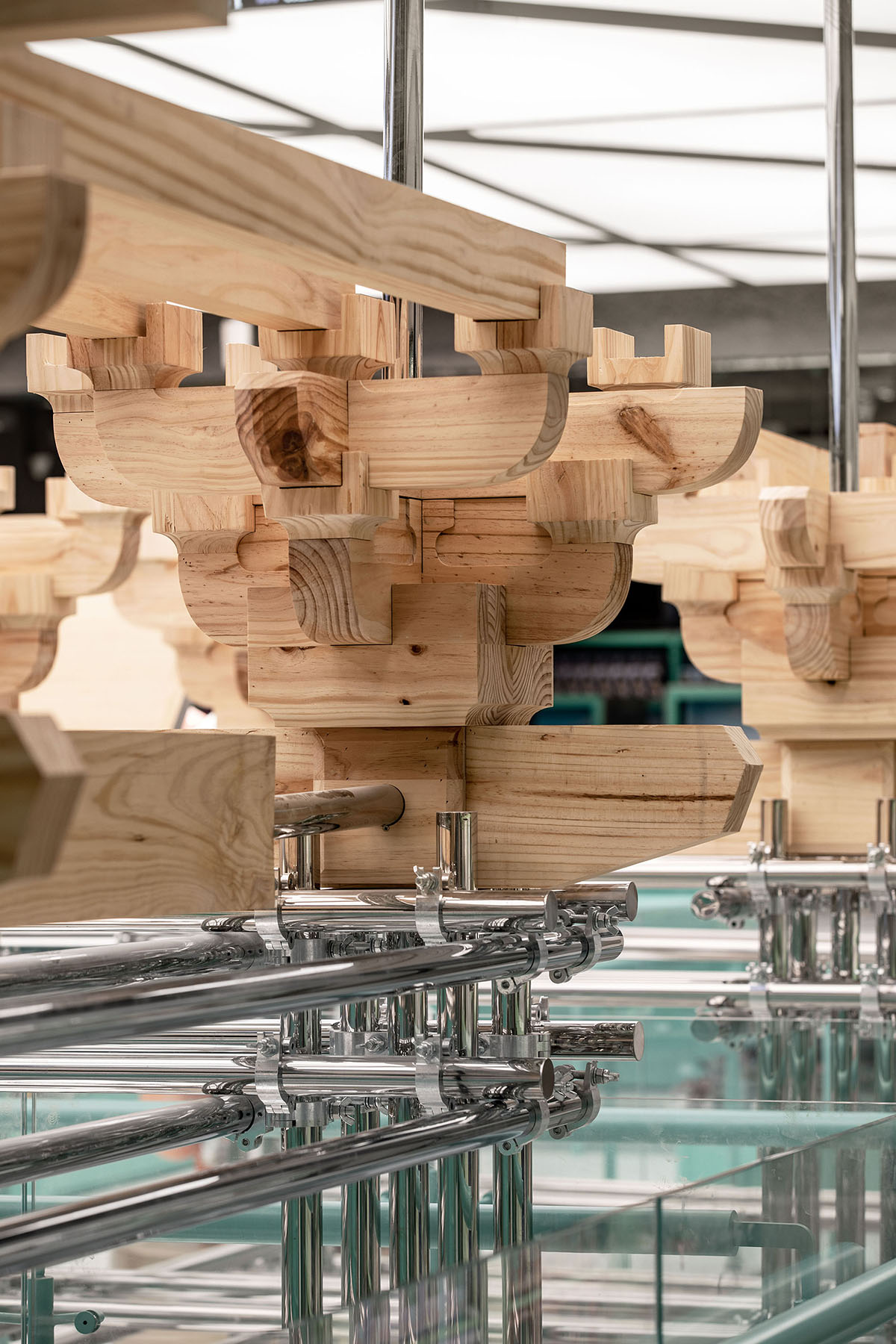 BloomDesign combines stainless steel tubes with timber joints to create retail store in China 