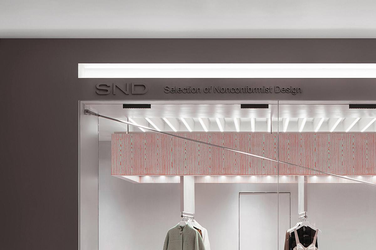 Various Associates creates show-like and pink-hued fashion store under a viaduct in Chongqing