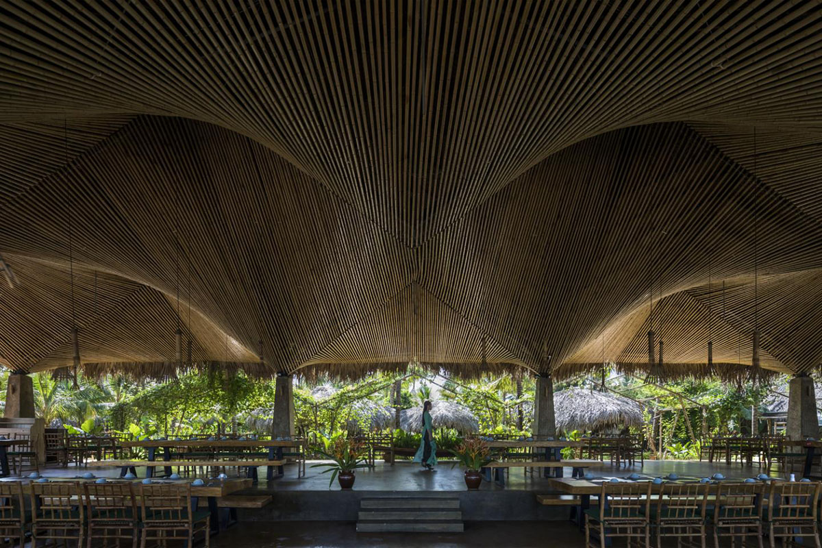 DDconcept Architecture uses coconut leaves and bamboo to create undulating restaurant in Vietnam